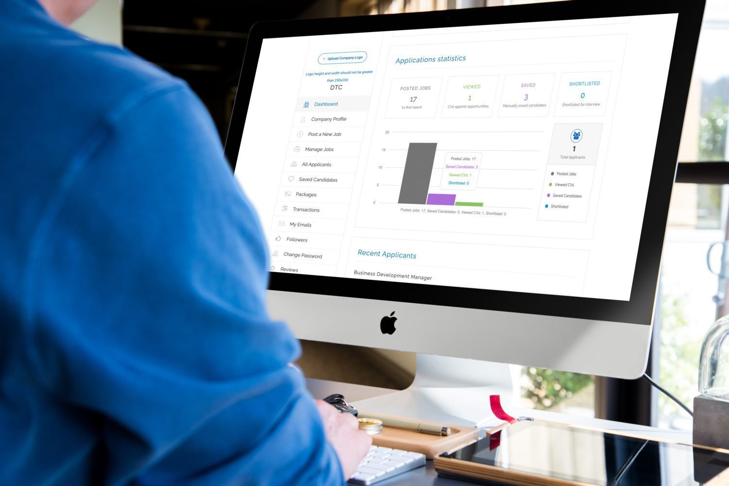 1839500 Man working on iMac