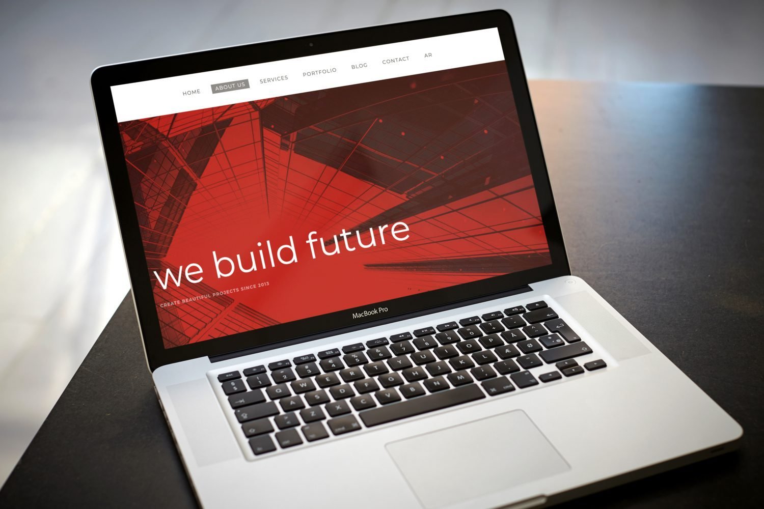 Macbook Pro on black table