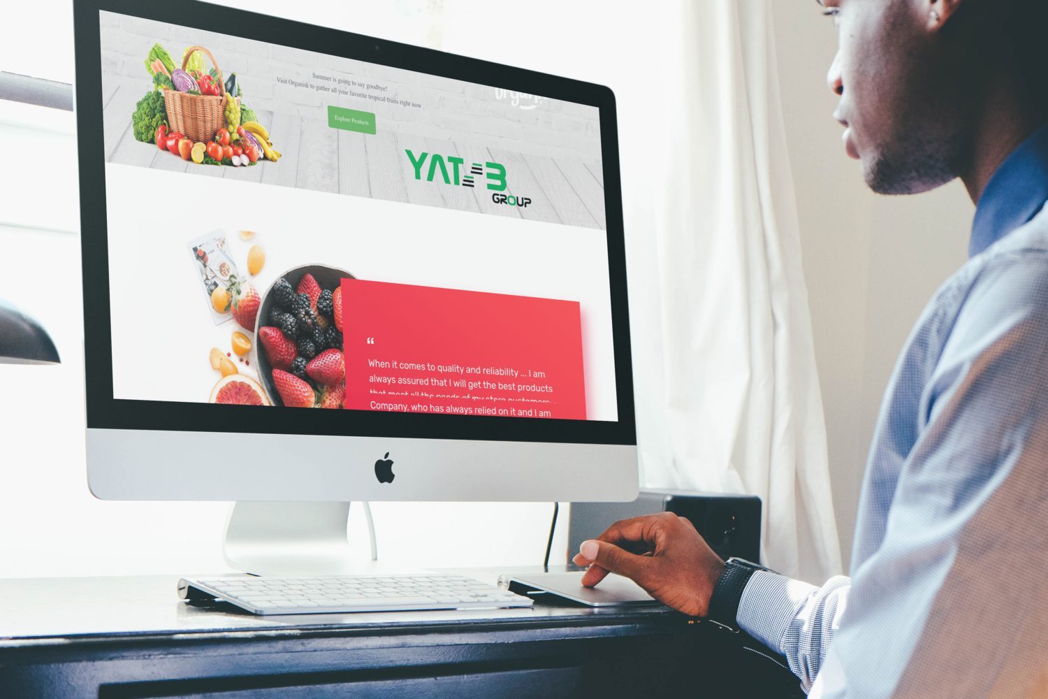 Man looking at iMac