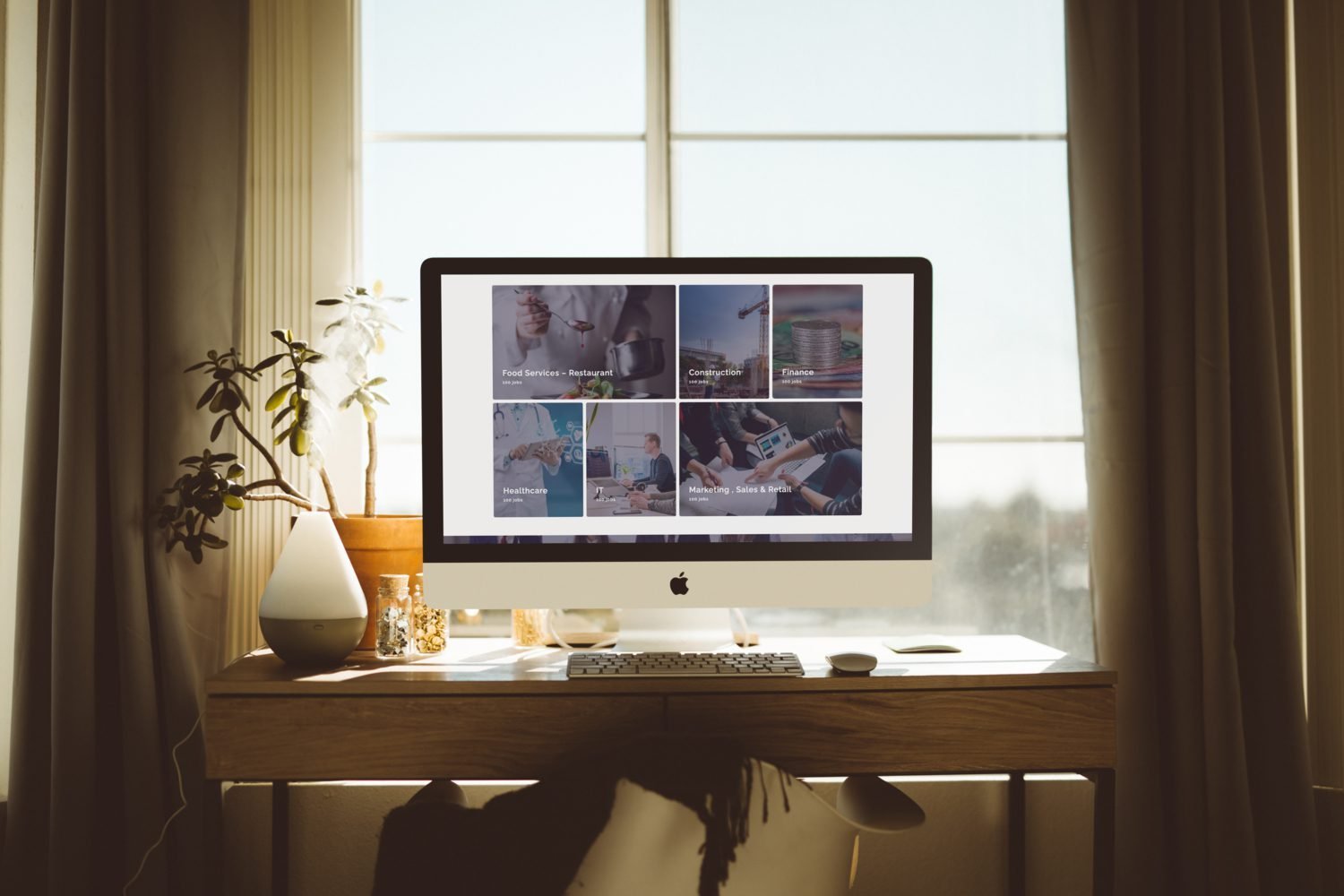 iMac on natural wood desk